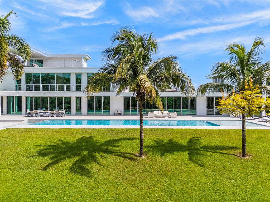 17250 Southwest 52nd Court Southwest Ranches, FL 33331 - Photo 6 of 62 a view of swimming pool with lawn chairs and plants