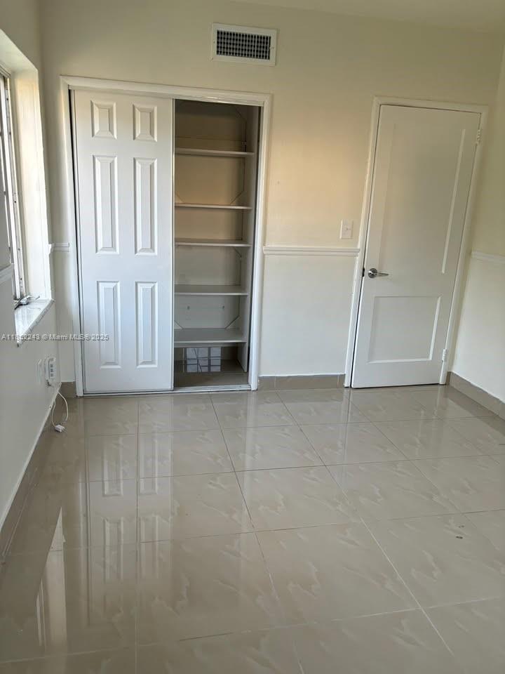 5740 Southwest 60th Street Miami, FL 33143 - Photo 3 of 7 an empty room with a empty space