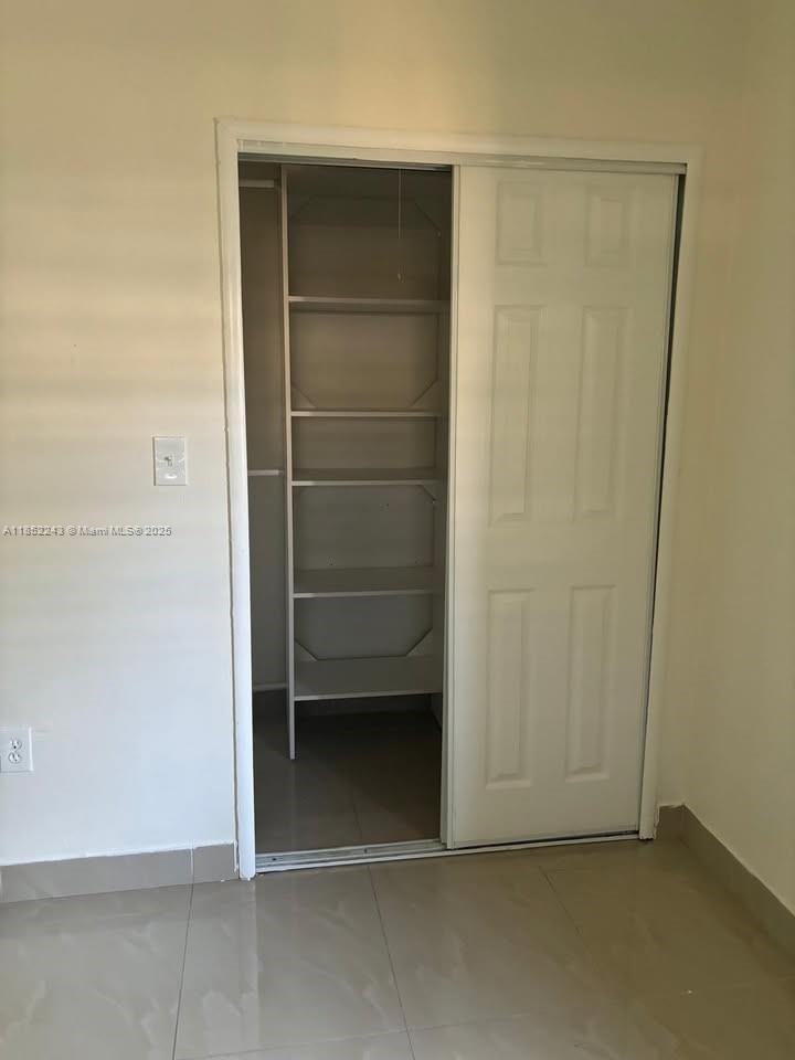 5740 Southwest 60th Street Miami, FL 33143 - Photo 4 of 7 a view of an empty room