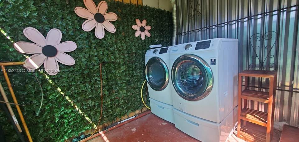 5740 Southwest 60th Street Miami, FL 33143 - Photo 7 of 7 a utility room with dryer and washer