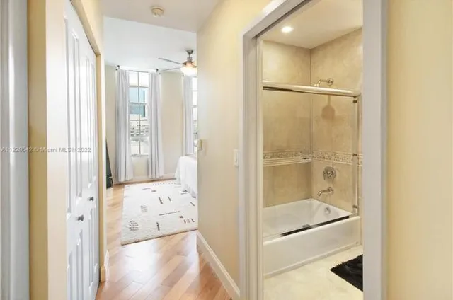 a bathroom with a glass shower door