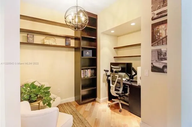 a view of a workspace with furniture