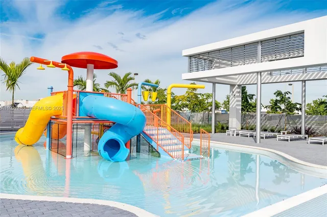 swimming pool view with a outdoor seating space