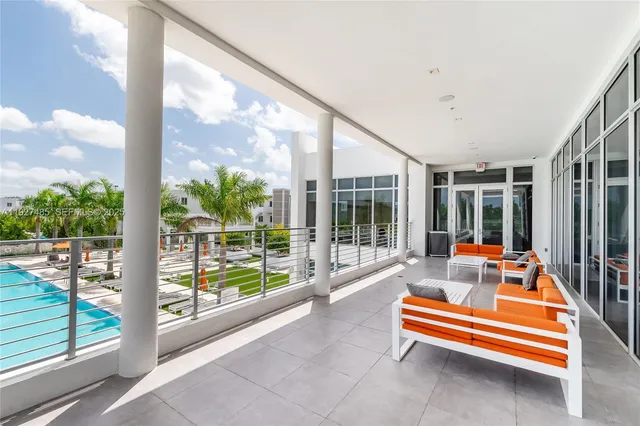 a sitting area with view of outdoor space