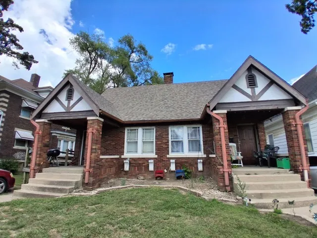 front view of a house with a yard