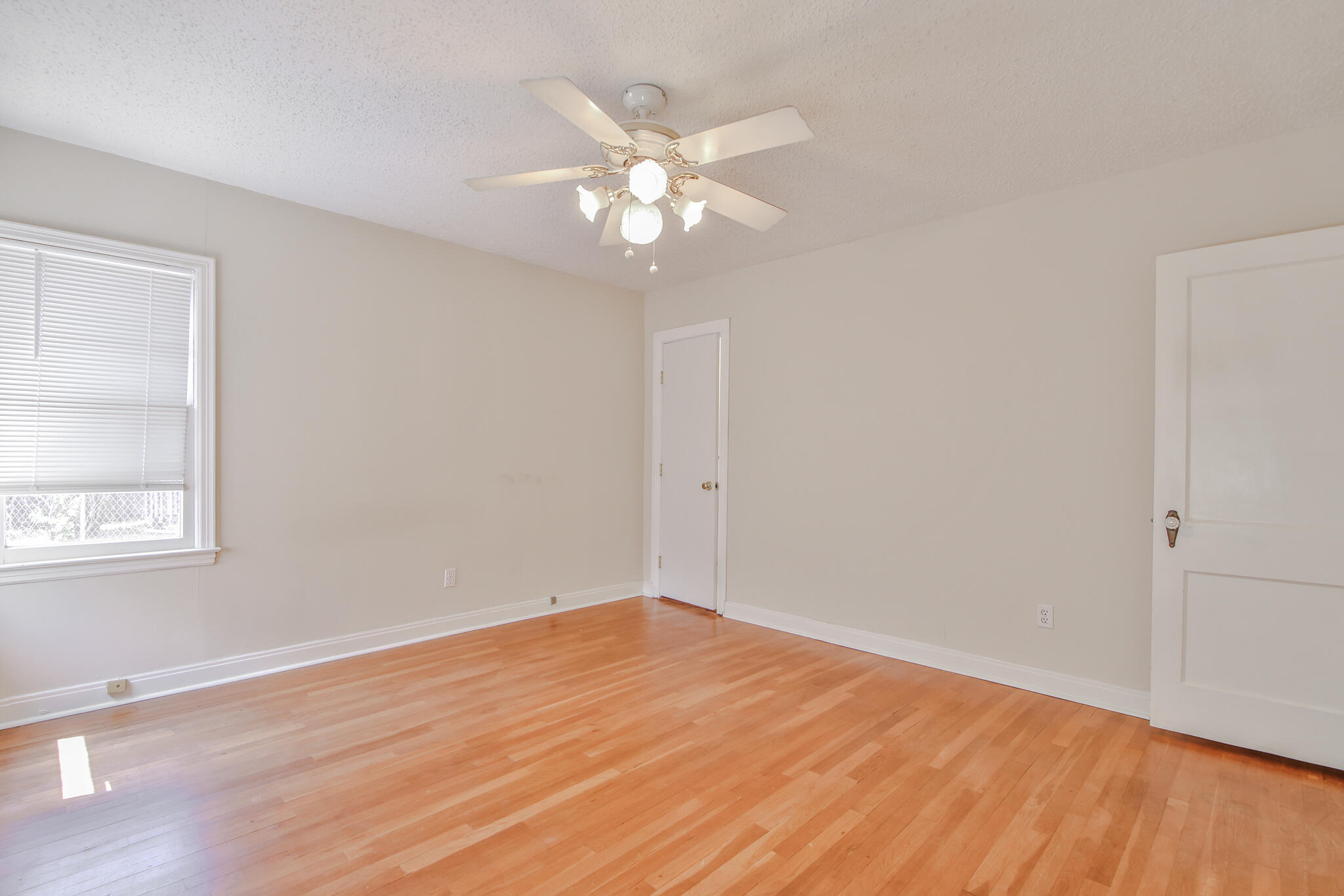 2715 29th Street Lubbock, TX 79410 - Photo 16 of 35 wooden floor in an empty room with a window