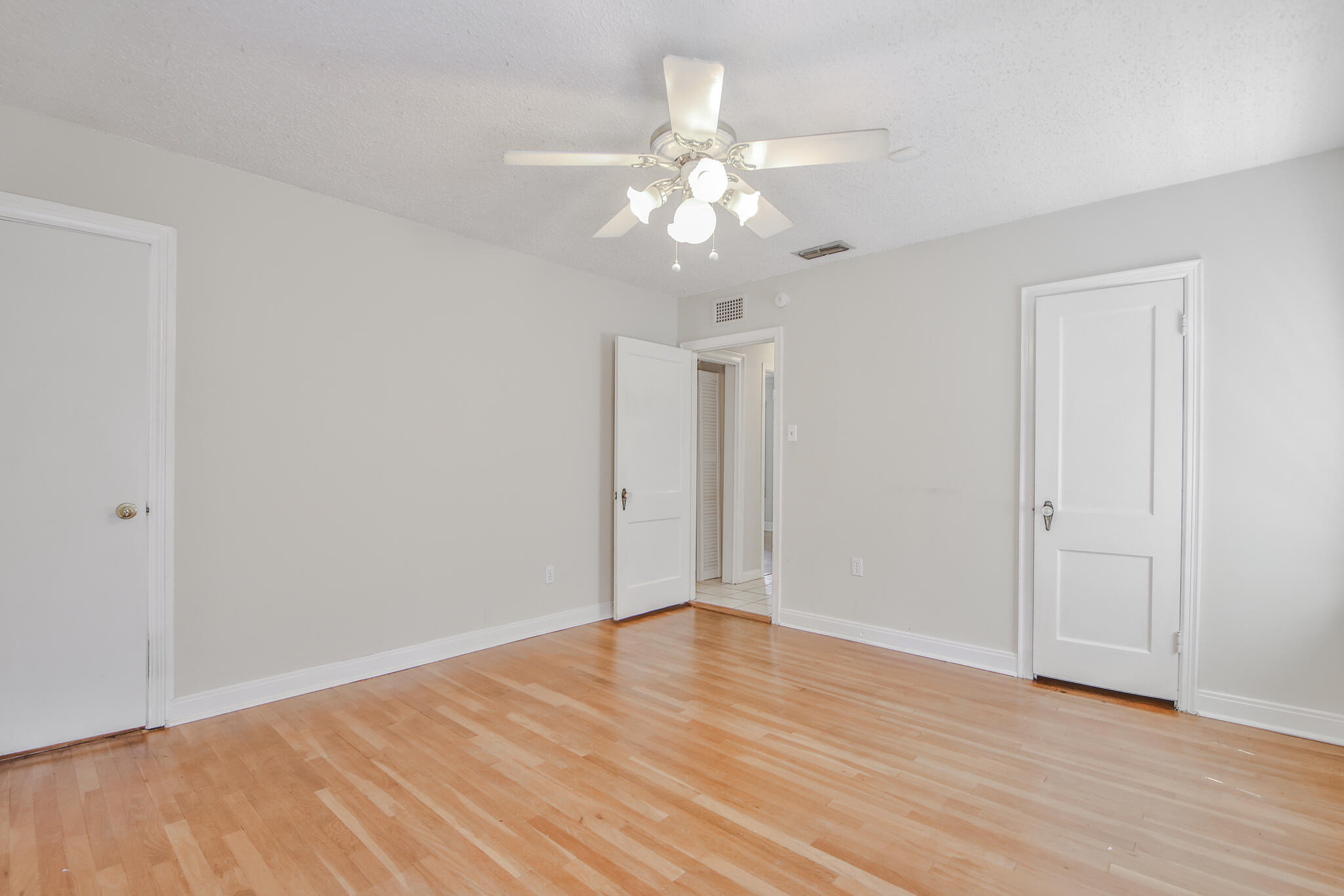 2715 29th Street Lubbock, TX 79410 - Photo 17 of 35 a view of an empty room with wooden floor