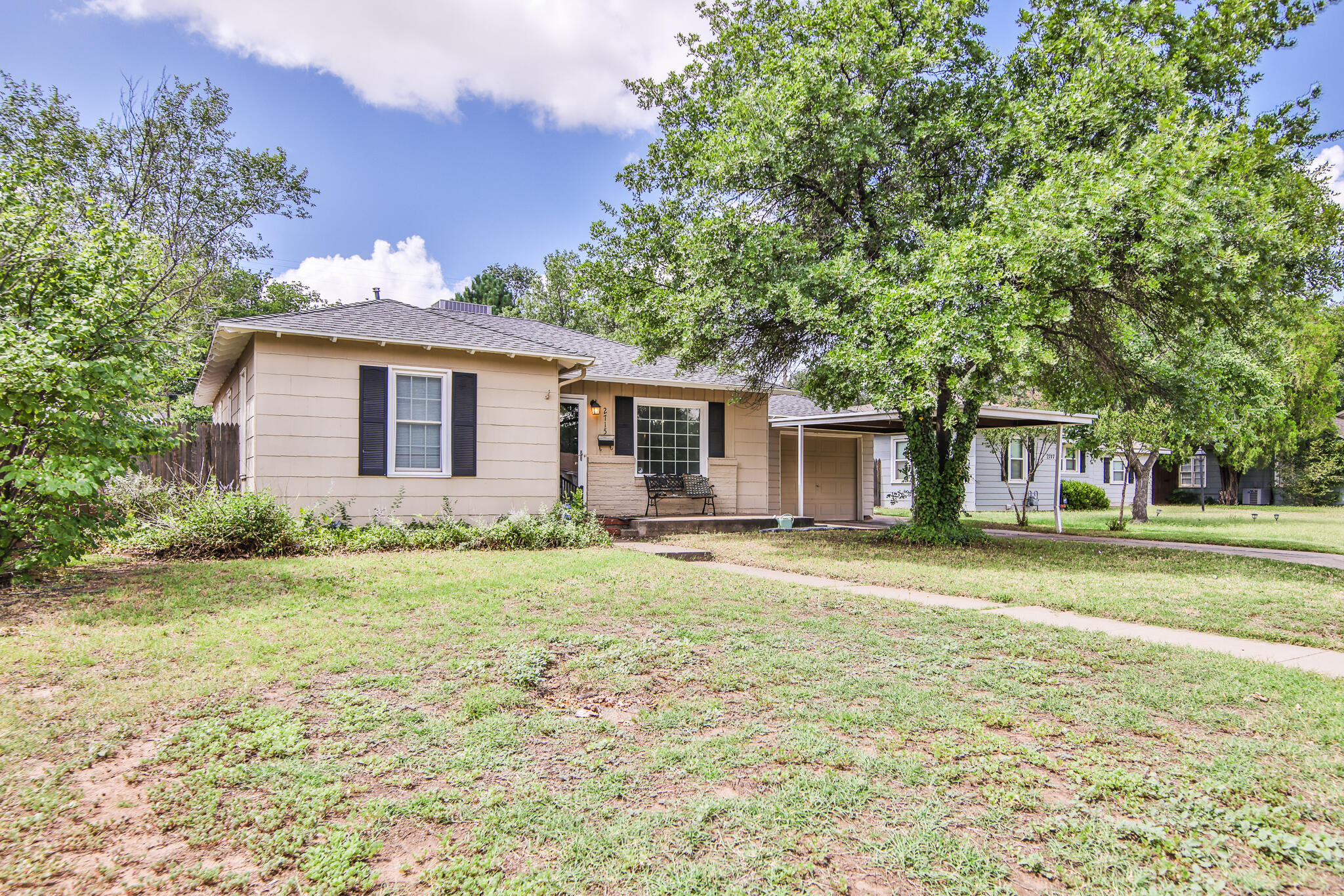 2715 29th Street Lubbock, TX 79410 - Photo 2 of 35 a view of a house with a yard