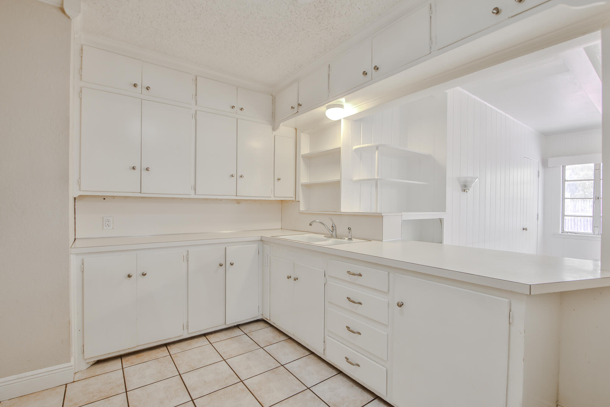 2715 29th Street Lubbock, TX 79410 - Photo 22 of 35 a view of cabinets and window