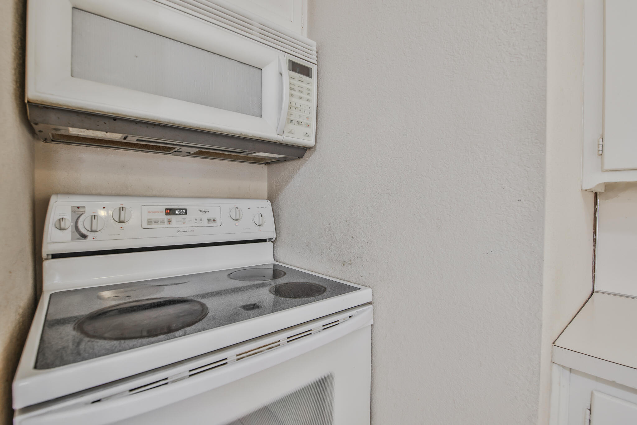 2715 29th Street Lubbock, TX 79410 - Photo 23 of 35 a stove top oven sitting inside of a kitchen