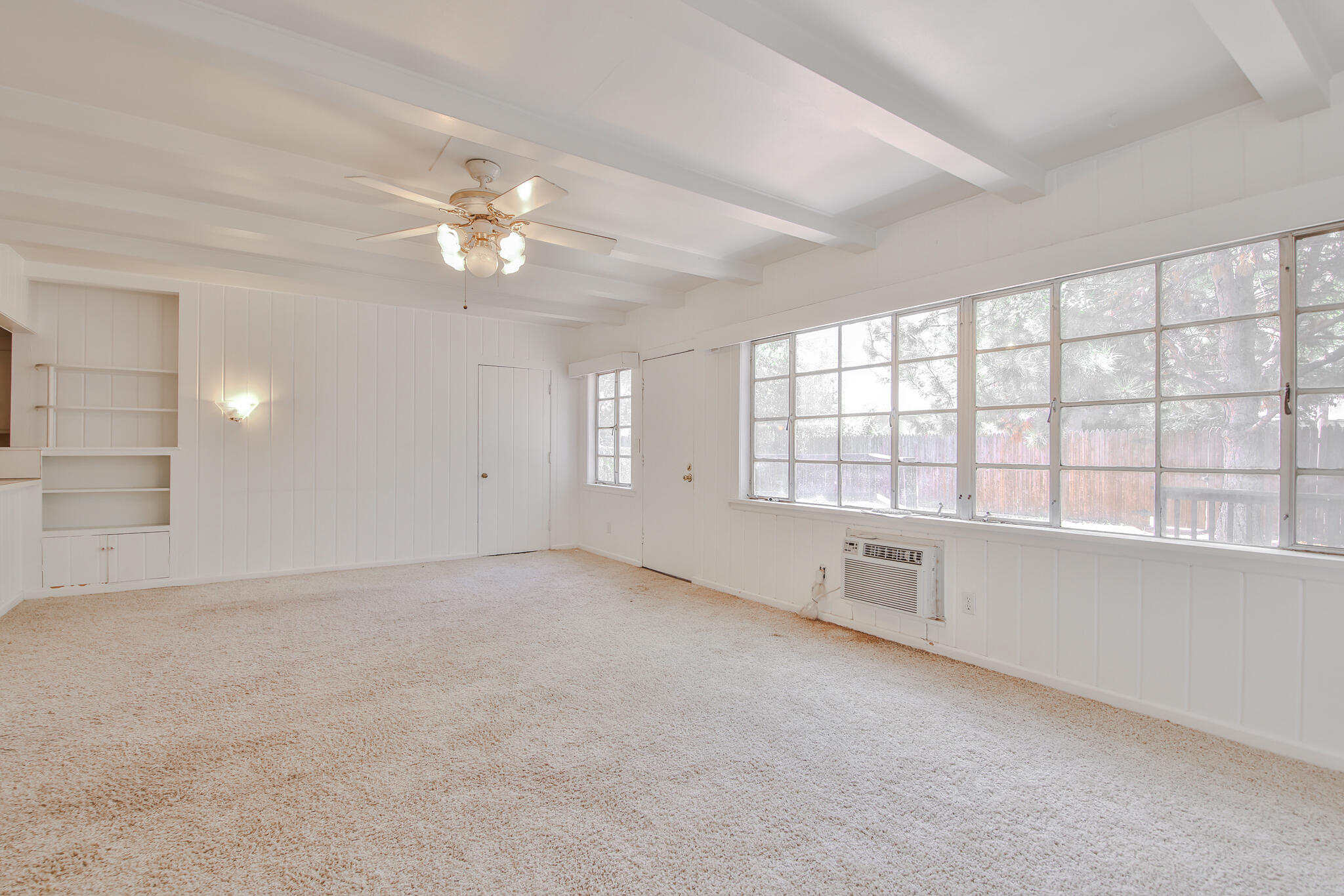 2715 29th Street Lubbock, TX 79410 - Photo 29 of 35 an empty room with chandelier fan and windows