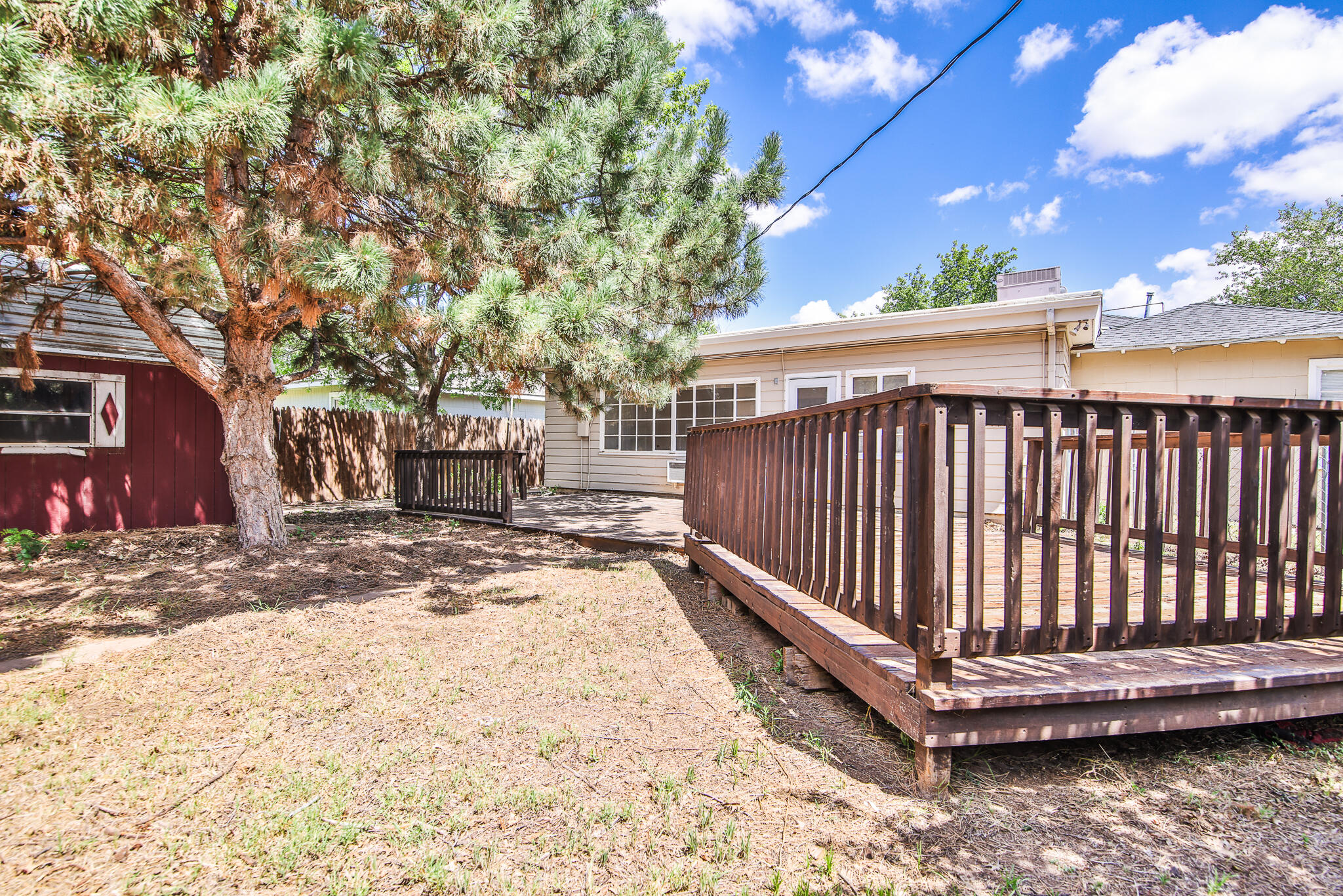 2715 29th Street Lubbock, TX 79410 - Photo 33 of 35 a view of a yard with wooden fence