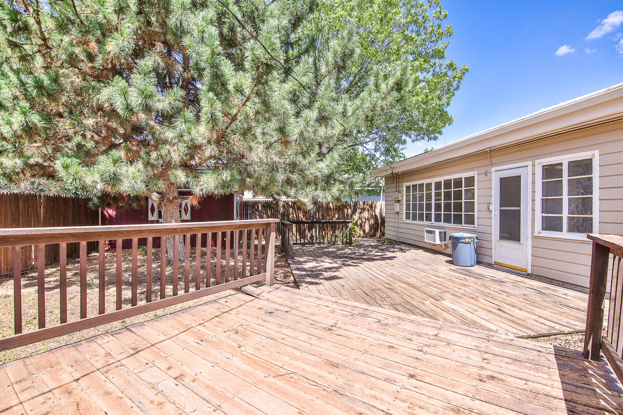 2715 29th Street Lubbock, TX 79410 - Photo 35 of 35 a view of balcony with wooden floor and fence