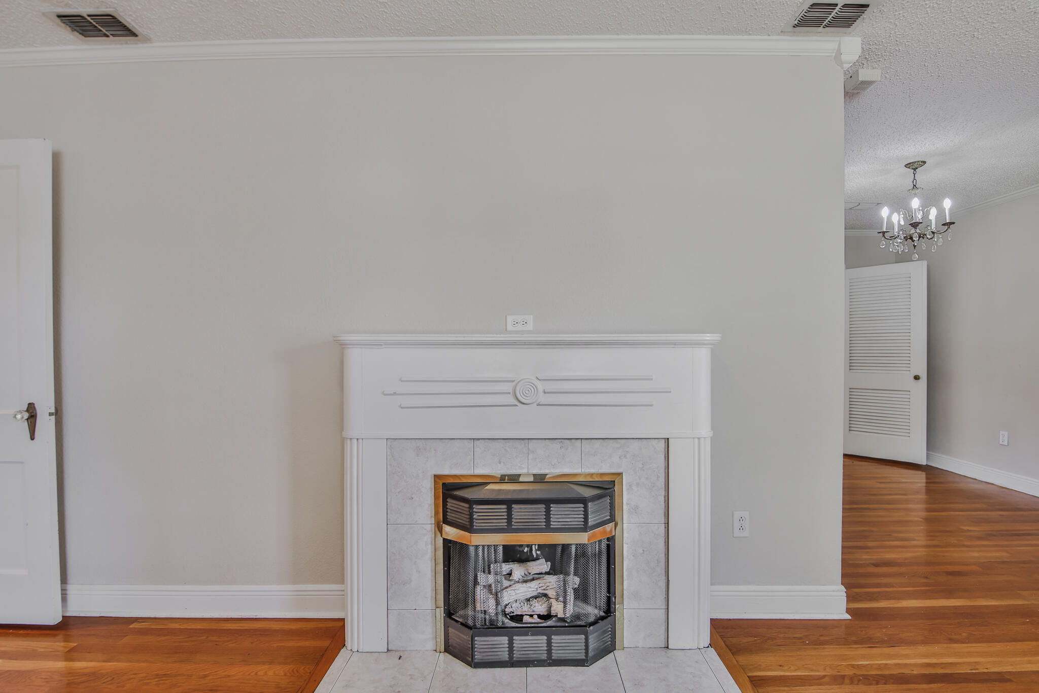 2715 29th Street Lubbock, TX 79410 - Photo 9 of 35 a living room with furniture and a fireplace