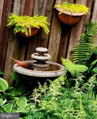 a bed sitting in a room next to a window