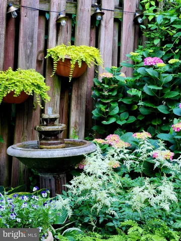 a room with a desk chair and painted walls