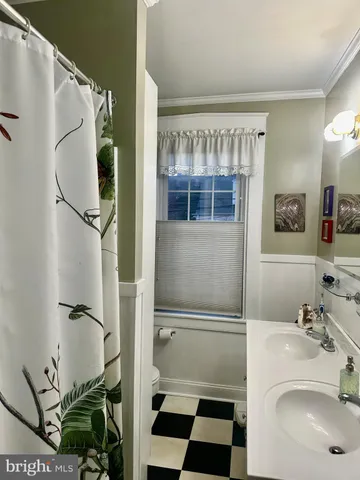 a kitchen with a table and chairs in it