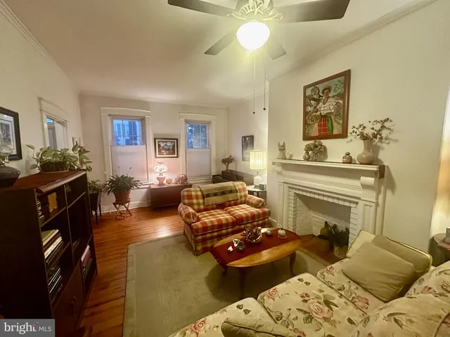 a room with wooden floors and furniture