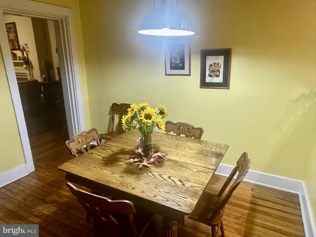 a bed sitting in a spacious bedroom next to a window