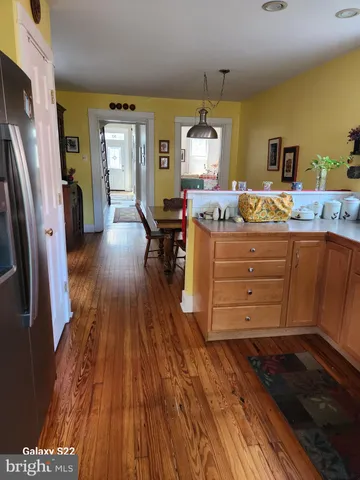 a bathroom with a granite countertop toilet and a shower