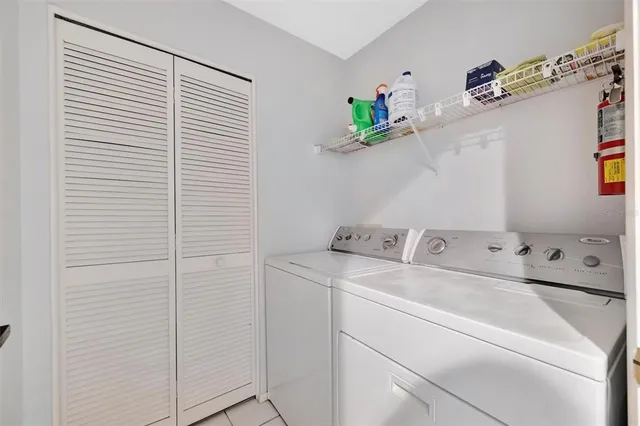 a front view of a house with garden and plants