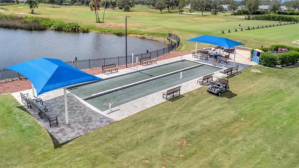 a view of a lake with a yard