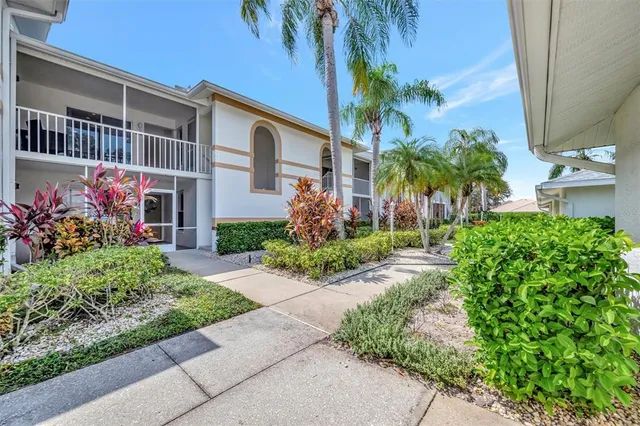 a view of a room with furniture and a window