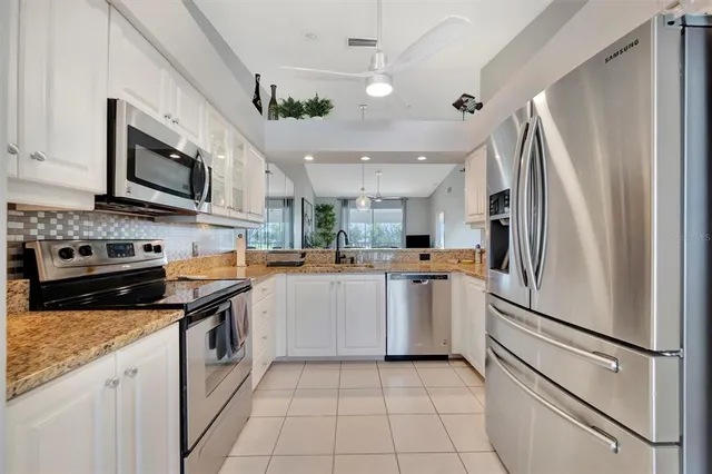 a view of a room with a table and chairs