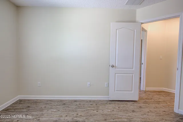a view of room with hardwood floor