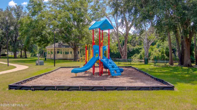 a view of a backyard with swimming pool