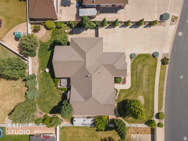 2327 Bluff Ridge Drive Syracuse, UT 84075 - Photo 60 of 66 Extensive concrete driveway, mature landscaping, and an architectural shingle roof