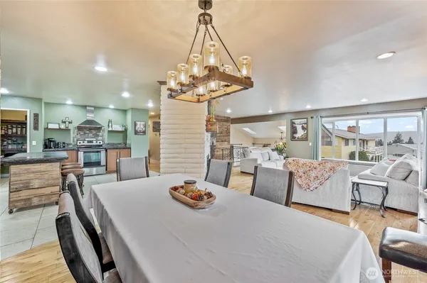 a living room with furniture and a chandelier