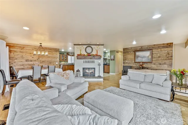 a living room with fireplace furniture and a fireplace