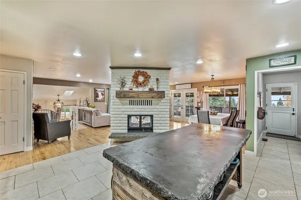 a living room with fireplace furniture and a flat screen tv