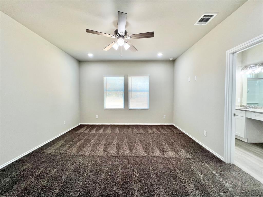 3501 East Renfro Street, Unit 201 Burleson, TX 76028 - Photo 16 of 33 wooden floor in an empty room with a window