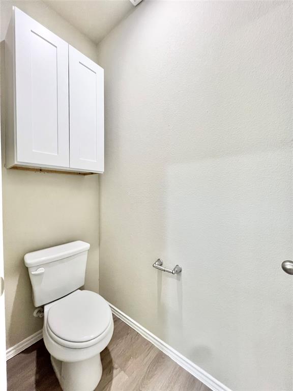3501 East Renfro Street, Unit 201 Burleson, TX 76028 - Photo 20 of 33 a white toilet sitting next to a shower