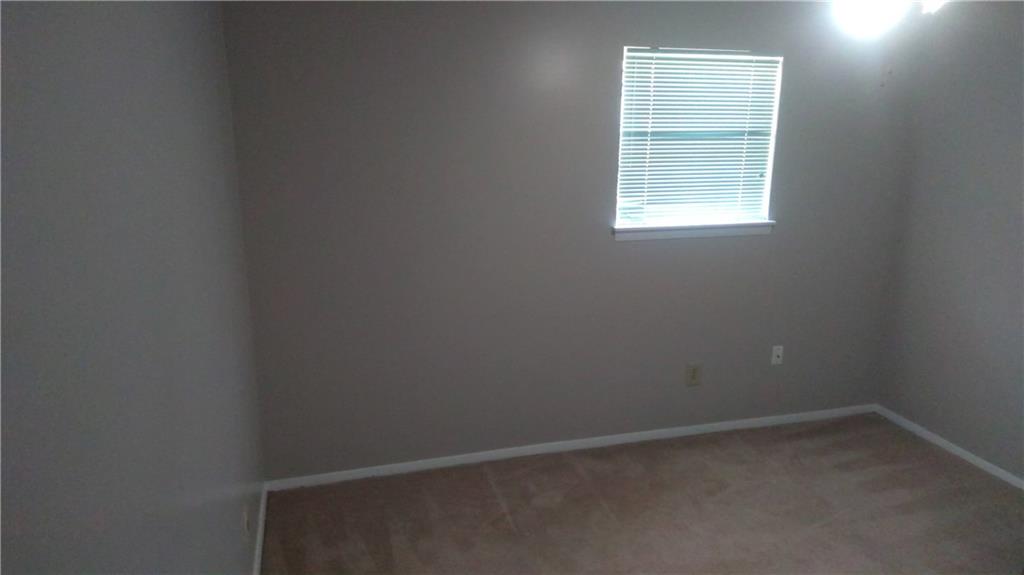 4701 Flat Shoals Road Union City, GA 30291 - Photo 11 of 23 an empty room with a window