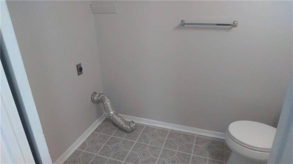4701 Flat Shoals Road Union City, GA 30291 - Photo 9 of 23 a bathroom with a toilet and a shower