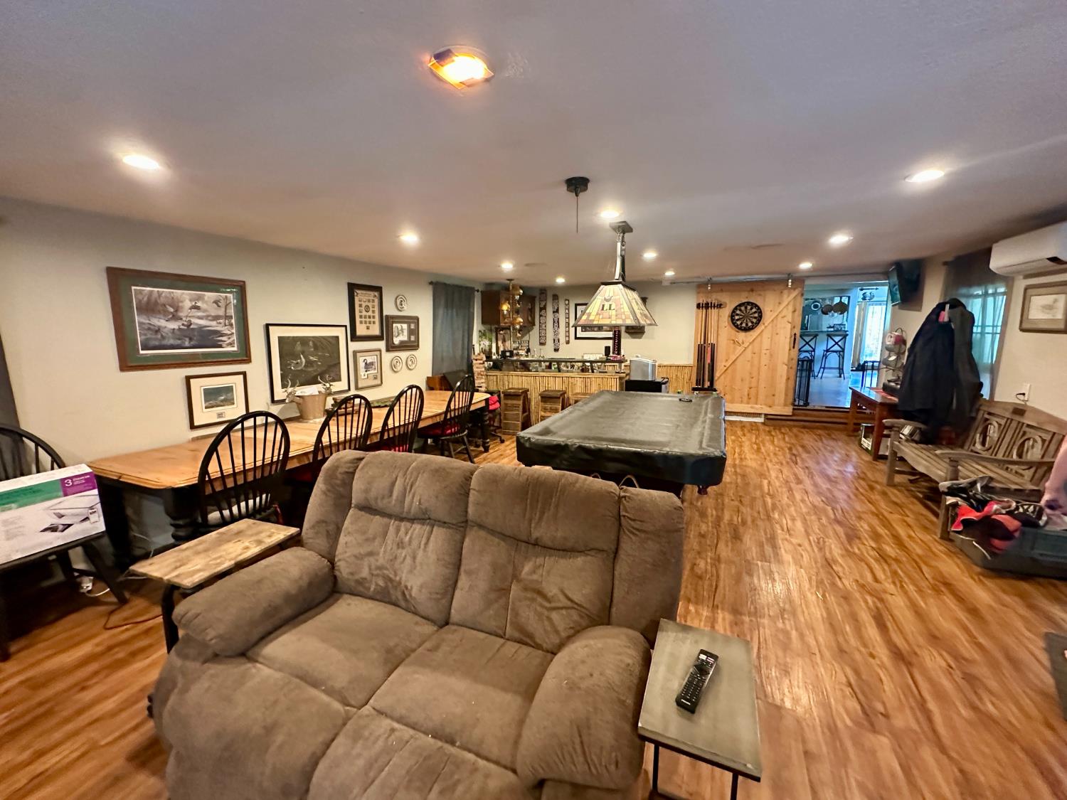 777 West Brannan Island Road Isleton, CA 95641 - Photo 19 of 24 a living room with furniture kitchen view and a wooden floor
