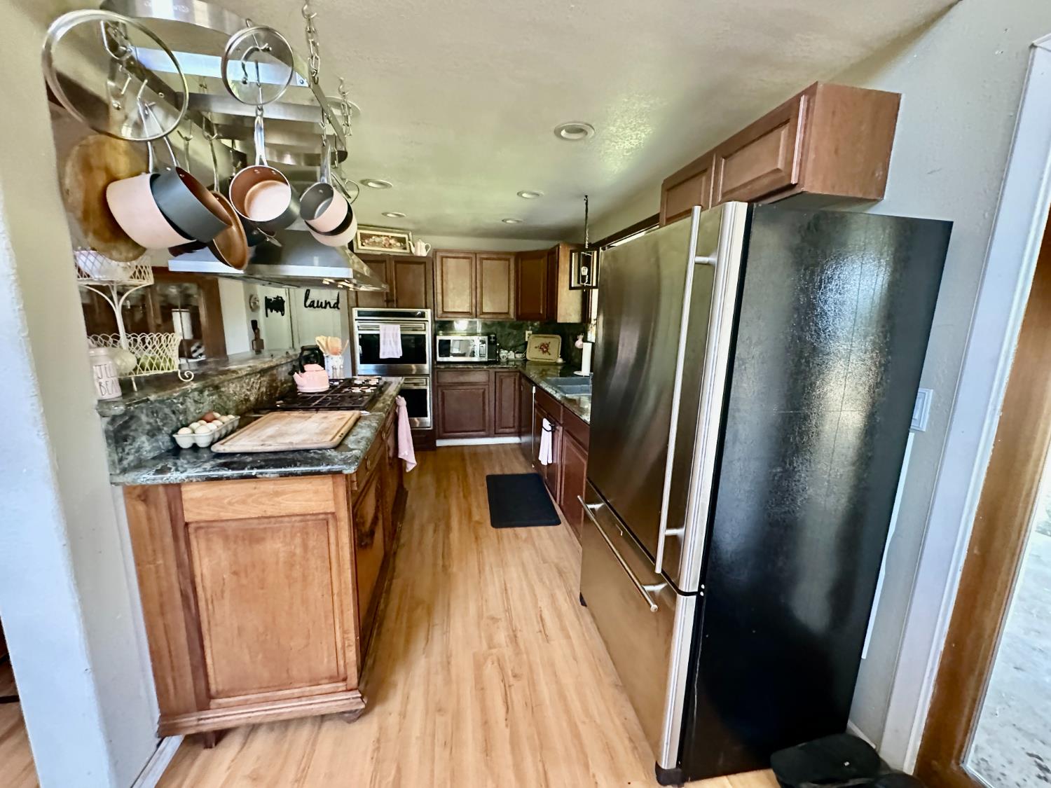 777 West Brannan Island Road Isleton, CA 95641 - Photo 4 of 24 a kitchen with stainless steel appliances granite countertop a refrigerator and a stove