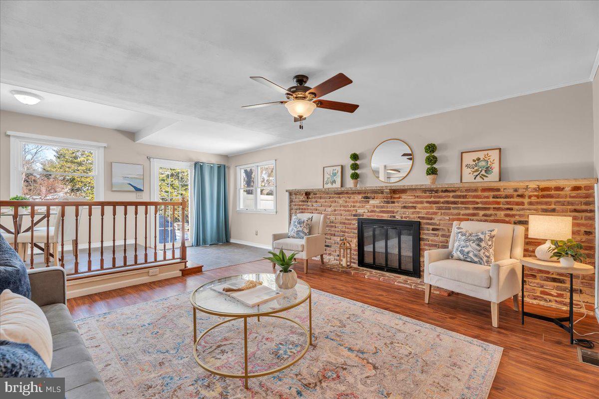 517 Perry Drive Mount Laurel, NJ 08054 - Photo 13 of 41 a living room with furniture a fireplace and a table