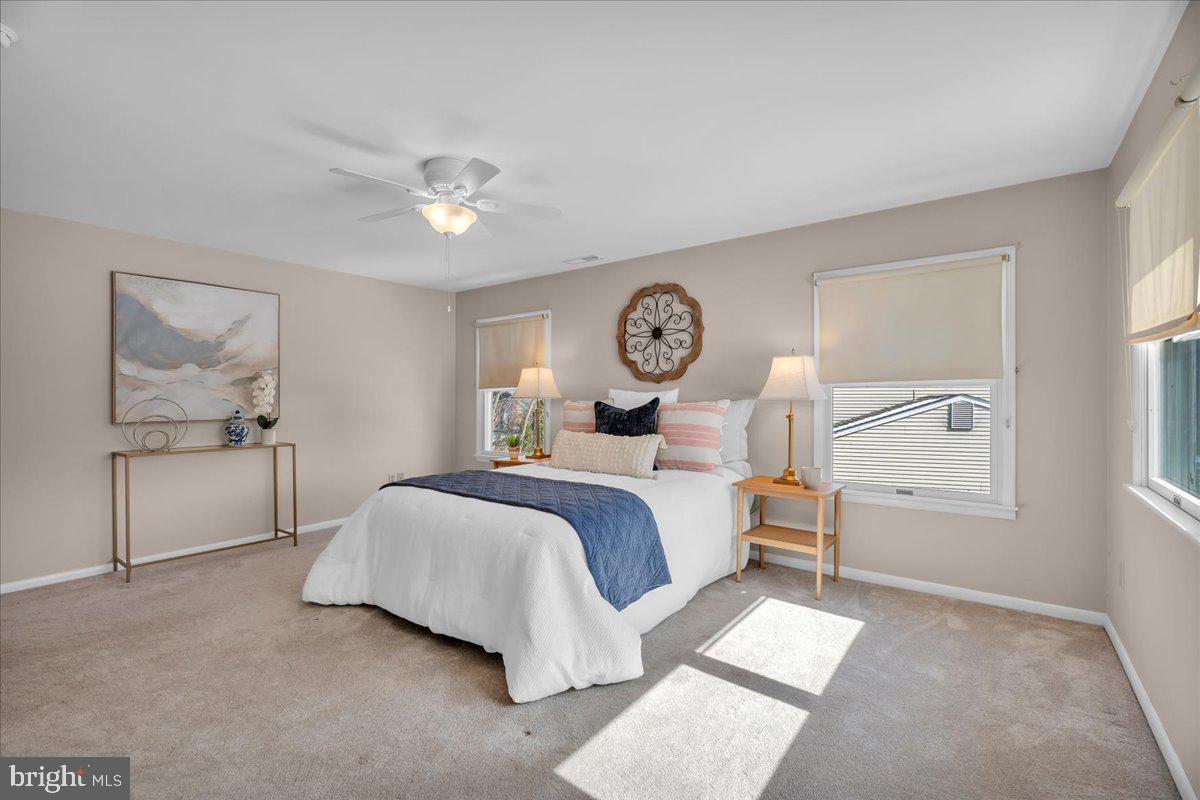 517 Perry Drive Mount Laurel, NJ 08054 - Photo 21 of 41 a bed room with a bed and a chandelier