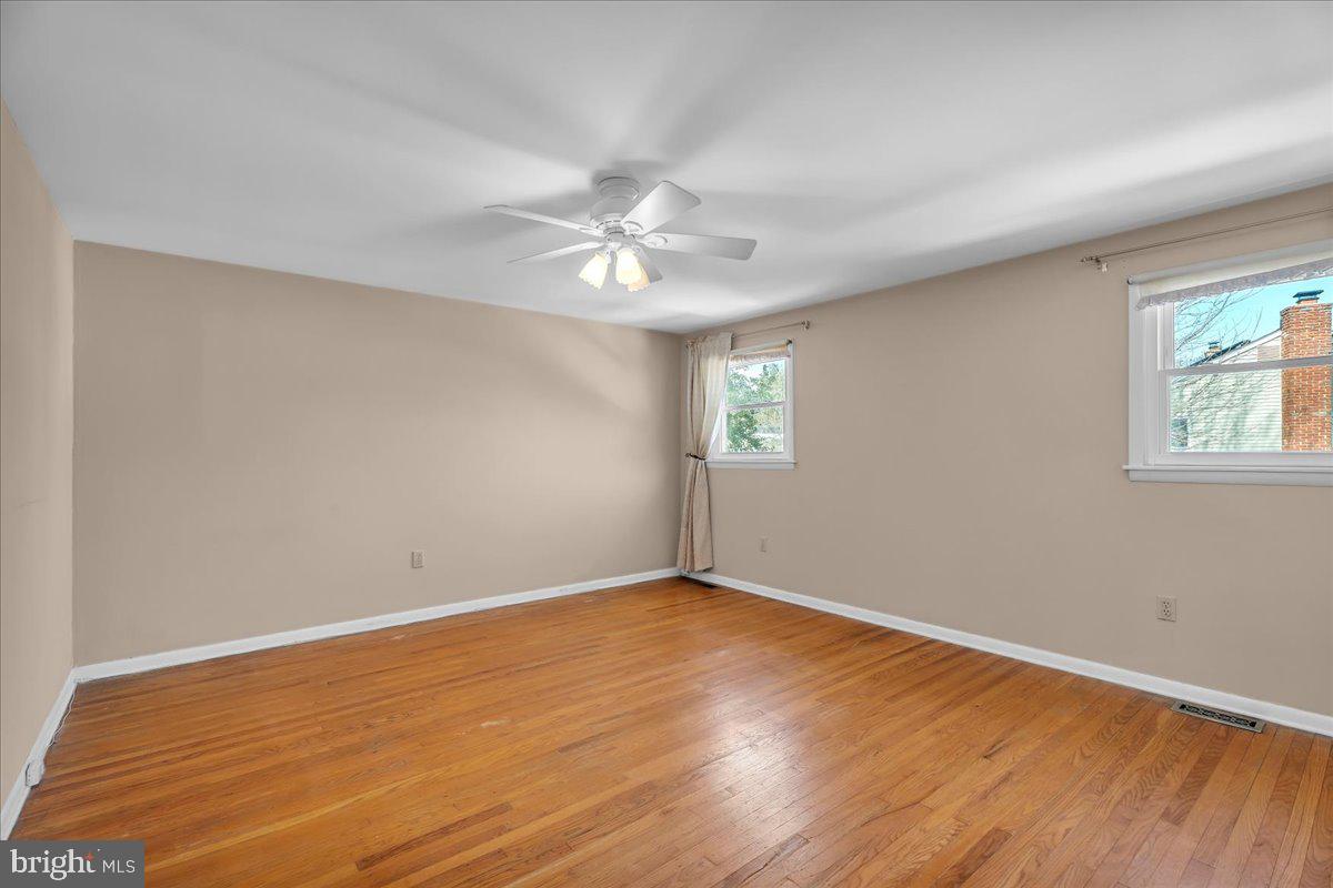 517 Perry Drive Mount Laurel, NJ 08054 - Photo 25 of 41 an empty room with wooden floor and windows