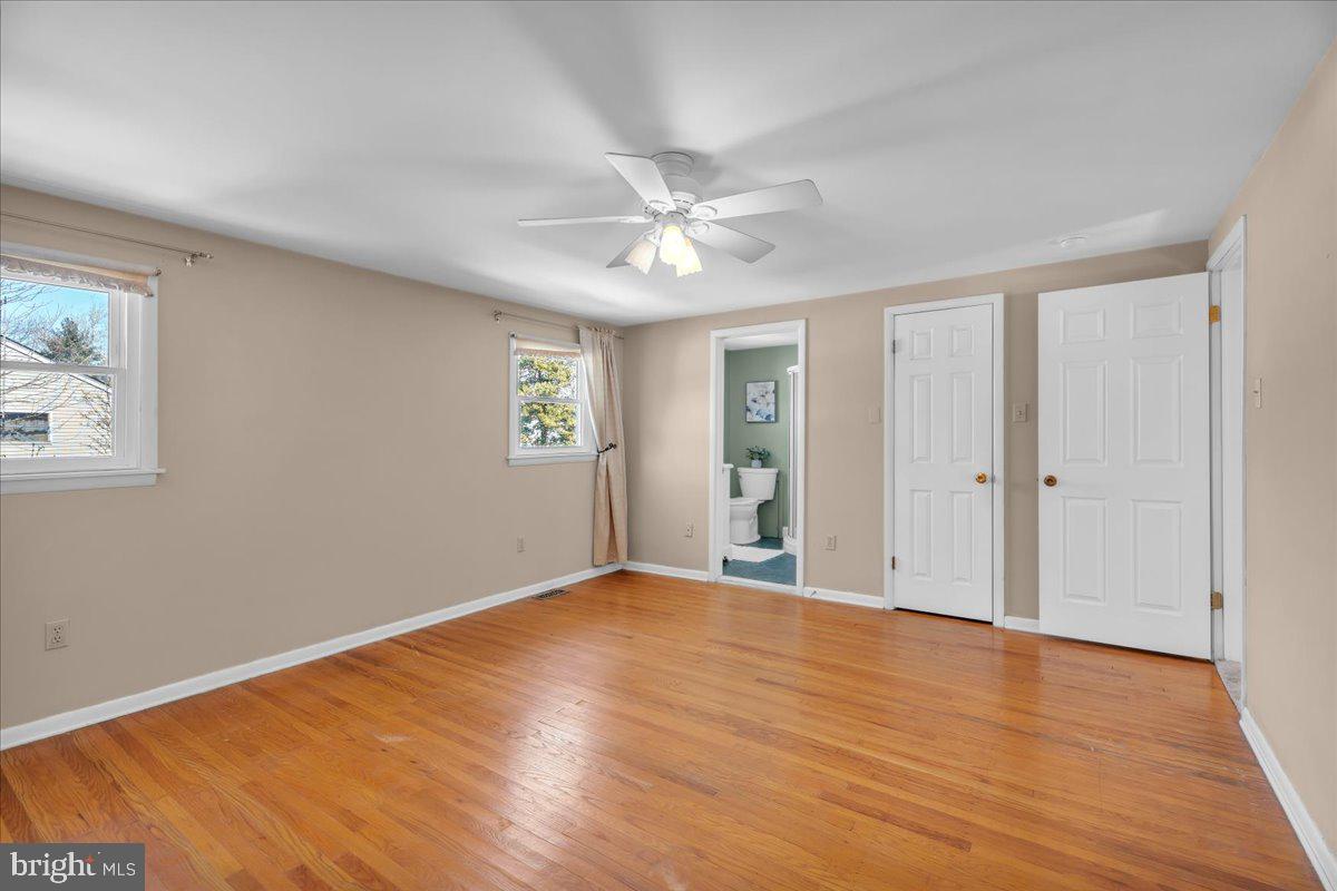 517 Perry Drive Mount Laurel, NJ 08054 - Photo 26 of 41 a view of an empty room with window and wooden floor