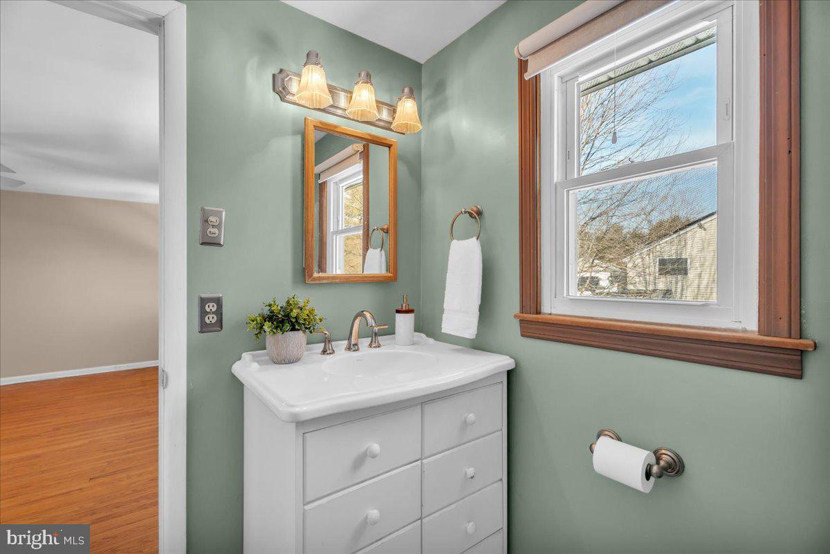 517 Perry Drive Mount Laurel, NJ 08054 - Photo 27 of 41 a bathroom with a sink a mirror and a window