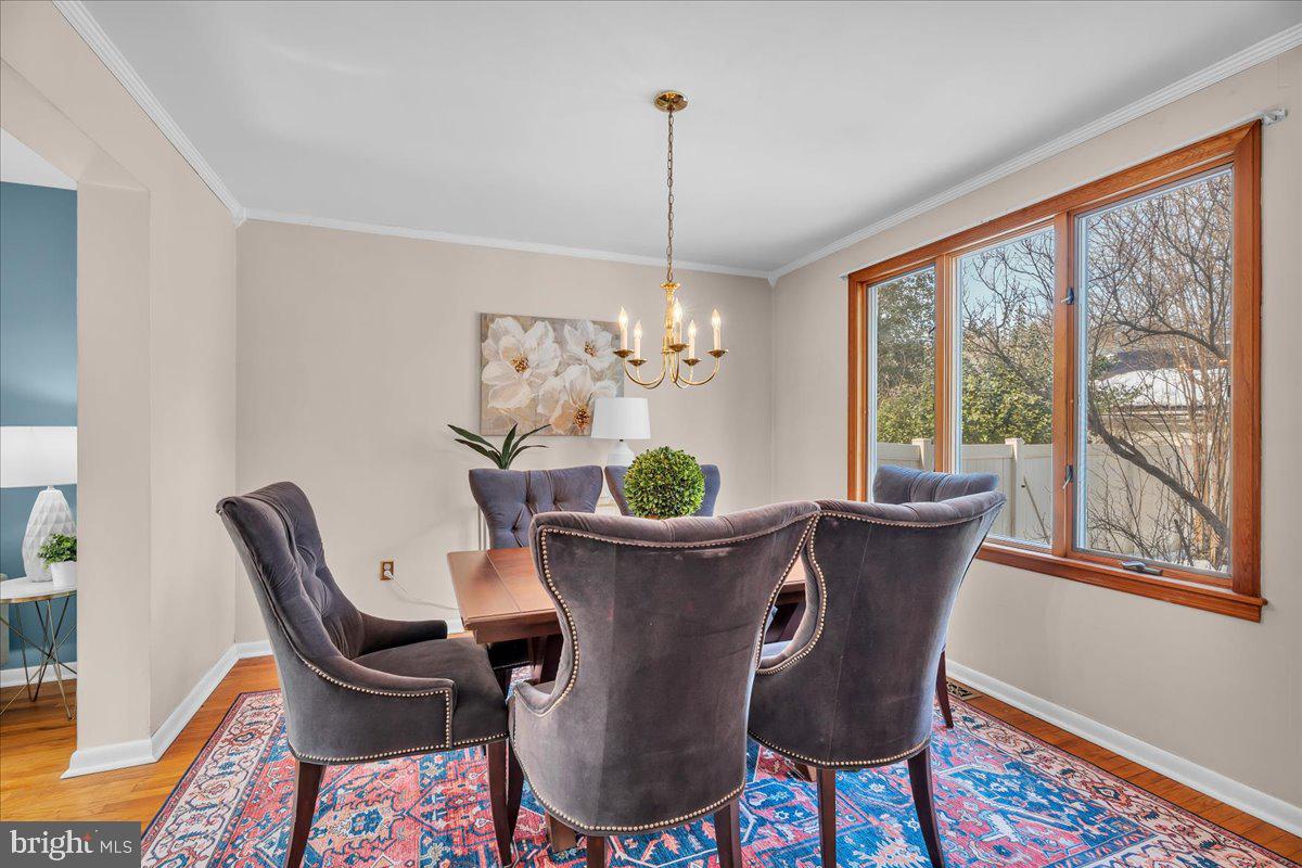 517 Perry Drive Mount Laurel, NJ 08054 - Photo 6 of 41 a dining room with furniture a potted plant and a chandelier