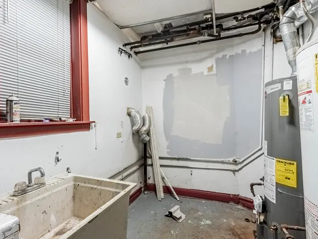 a bathroom with a tub and a sink