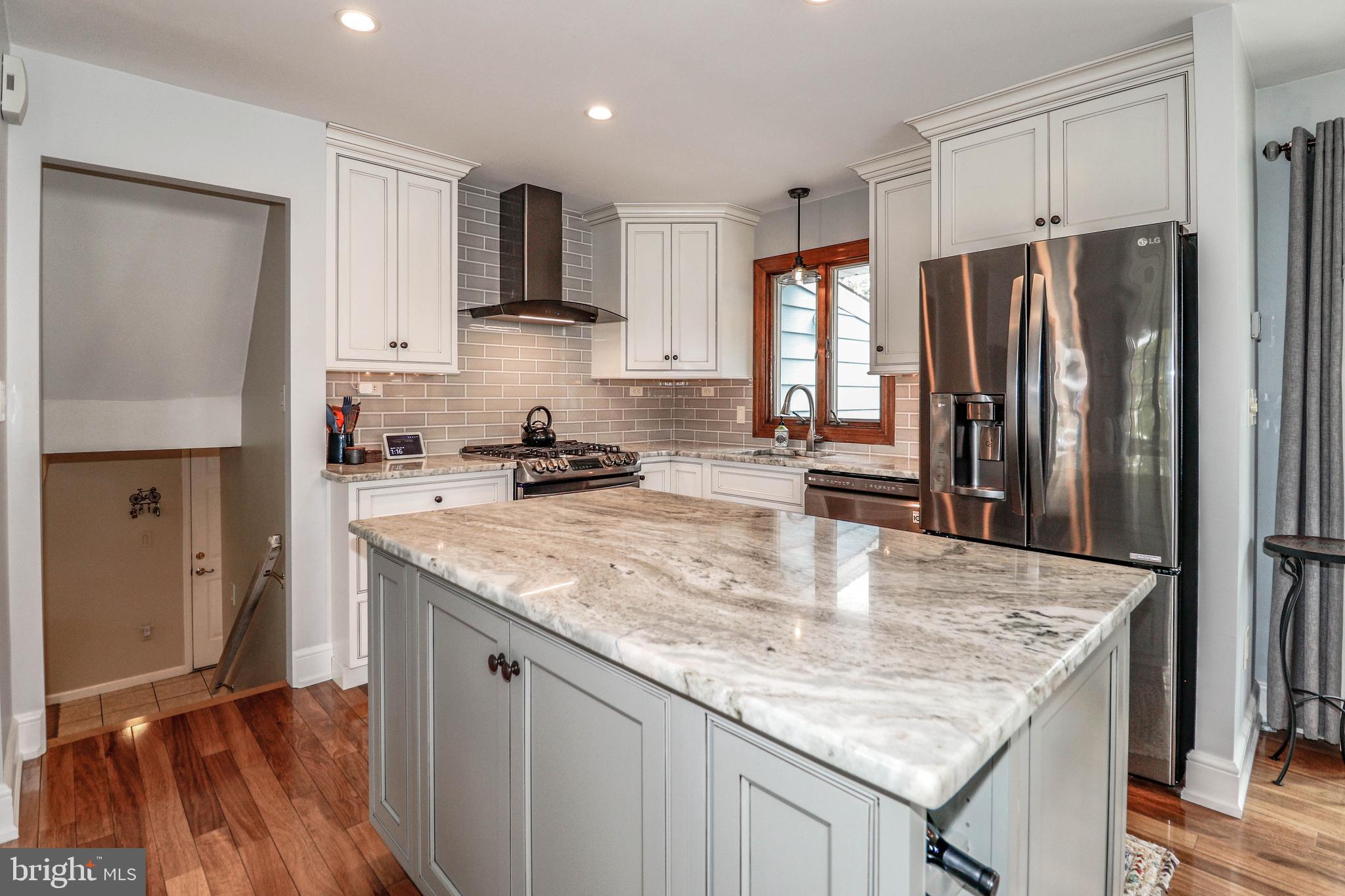 94 Winding Way Hamilton, NJ 08620 - Photo 13 of 38 a kitchen with granite countertop a sink a counter space stainless steel appliances and cabinets