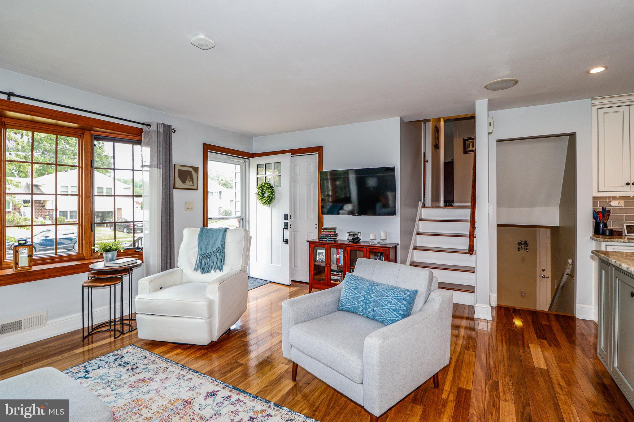 94 Winding Way Hamilton, NJ 08620 - Photo 14 of 38 a living room with furniture and a flat screen tv