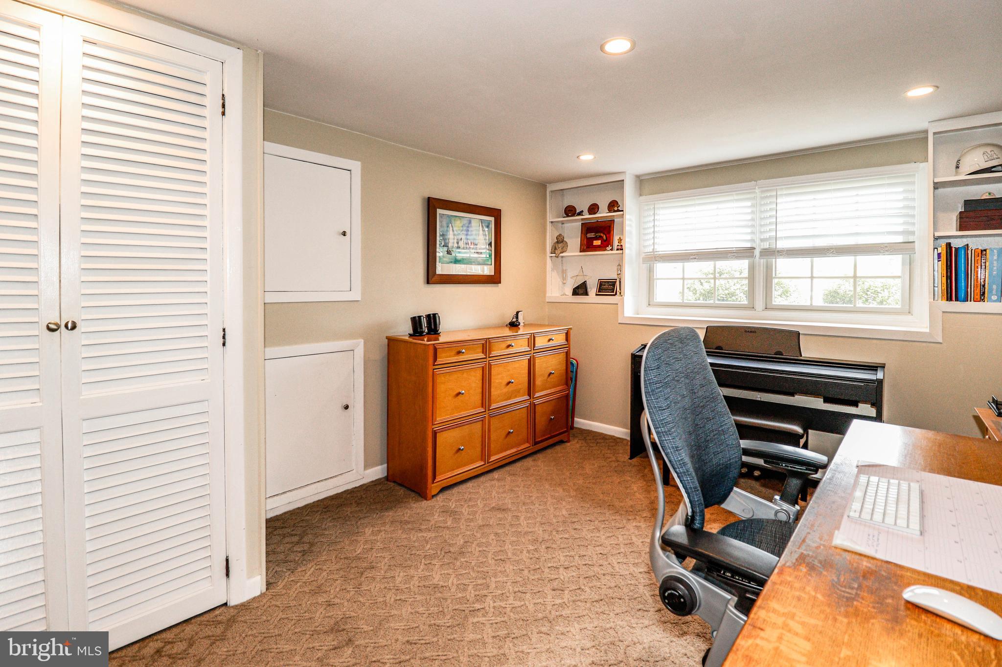 94 Winding Way Hamilton, NJ 08620 - Photo 15 of 38 a view of a workspace with furniture and a window